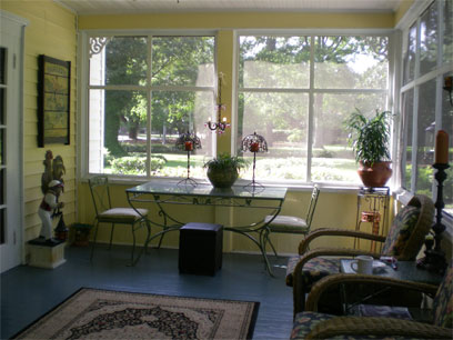 The airy, sunlit Oak Manor Inn porch is wonderful for afternoon relaxation.